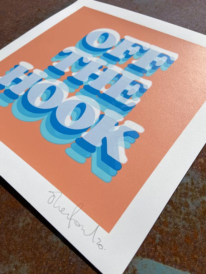 "Off The Hook" Hand Pulled Screen Print square with orange coral background and the words off the hook printed on top in shades of blue 