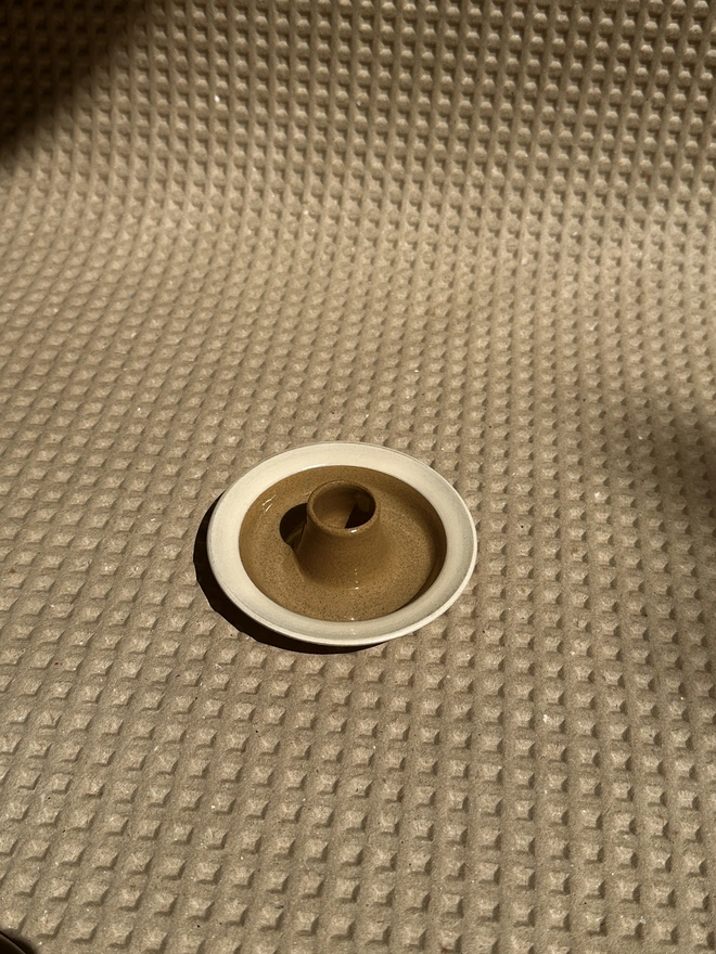 Beige and cream flat candle holder