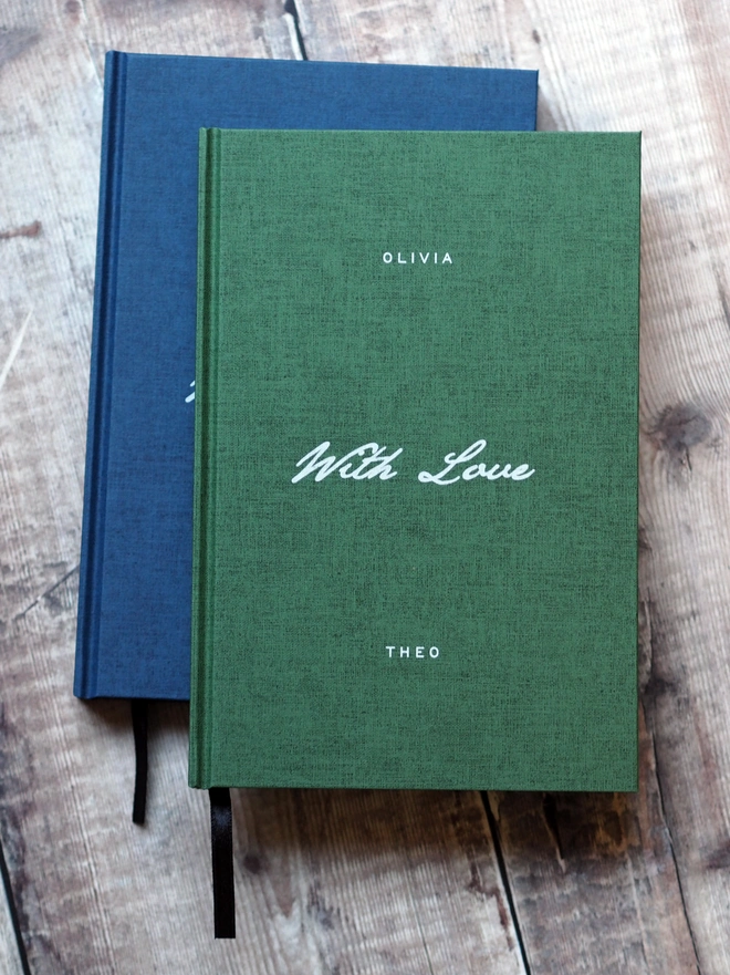 Personalised Hardcover With Love Notebook. A green linen hardcover journal with the words With Love written across the middle in a script font in white ink. The book is personalised with a name at the top and at the bottom of the book.