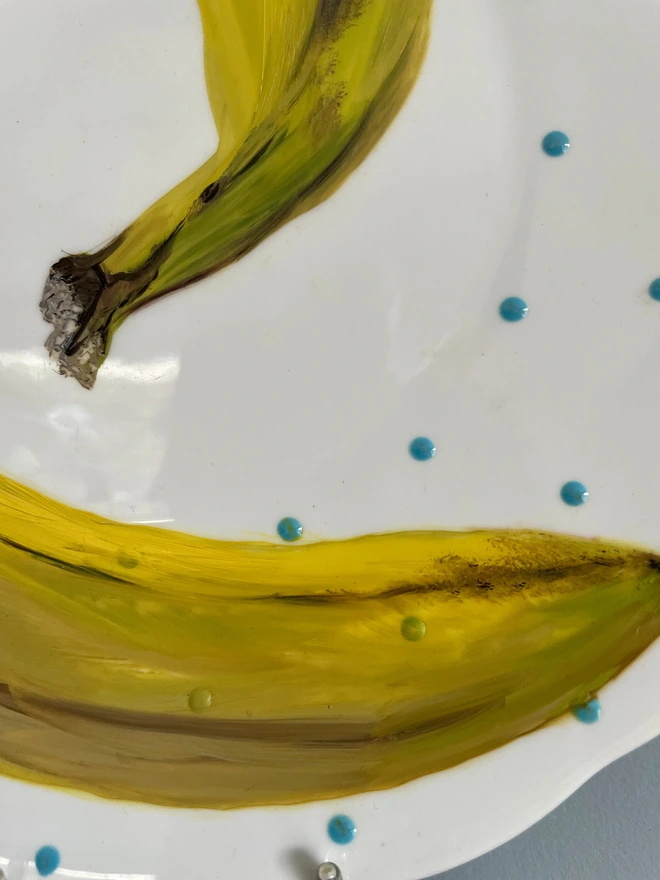 detail of banana painting on plate
