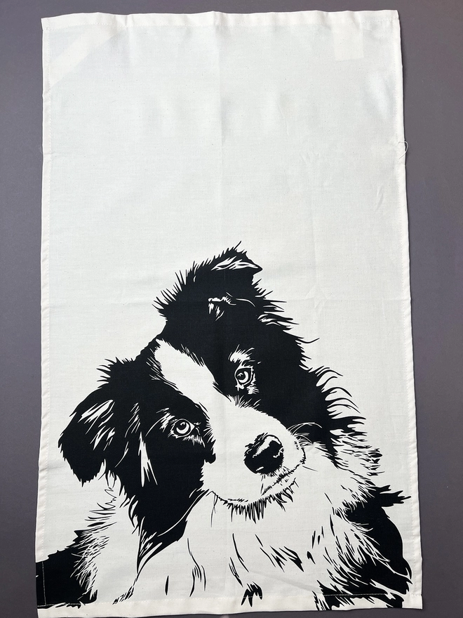 Full image of border collie dog tea towel with the collies head printed in the bottom half