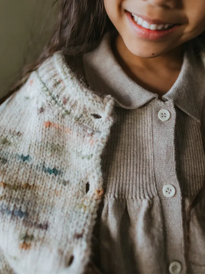 MABLI's 'Blewog' collection in the 'Jewel Speckle' colourway. This soft, fluffy, relaxed-fit cardigan features a speckled, cloud-like chunky yarn