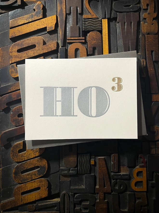 Ho Ho Ho! A beautiful typographic letterpress Christmas card. Printed in rich metallic silver and gold inks with luxury matching and contrasting envelopes; ideal to send to your designer friends at the festive season.