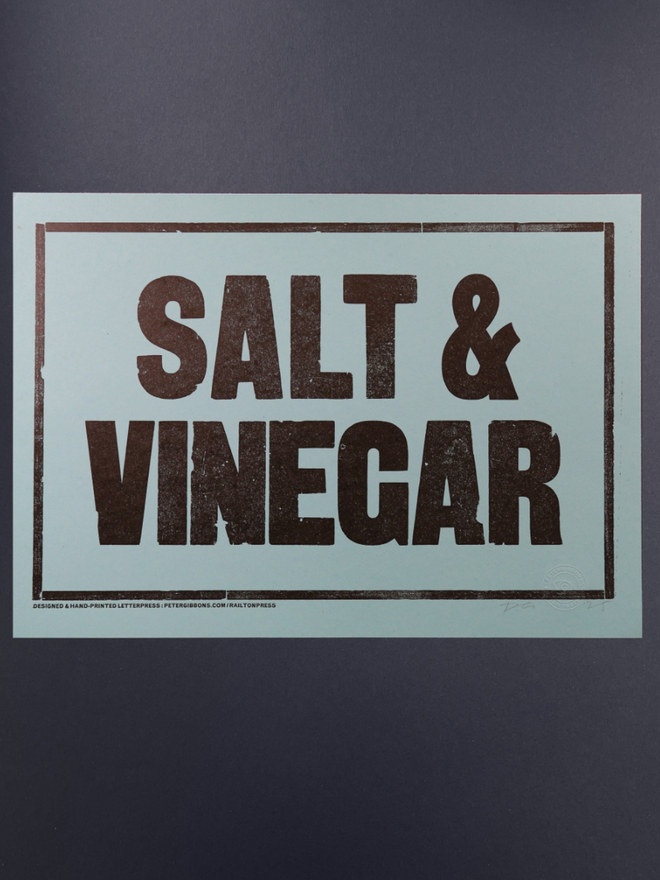 Salt and Vinegar Print. A print with a blue background and blocky black text.