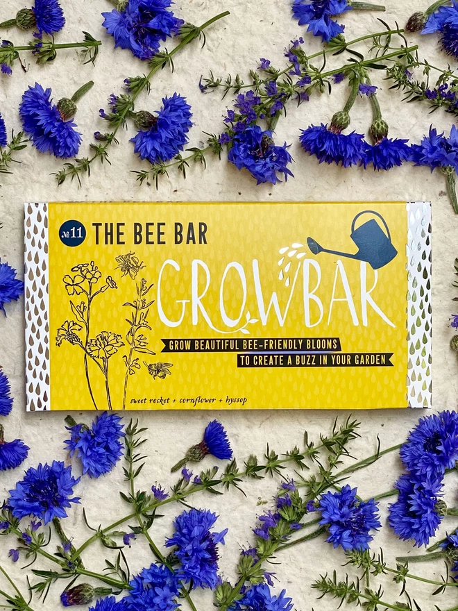 The Bee Growbar surrounded by colourful blue and purple pollinator friendly plants.