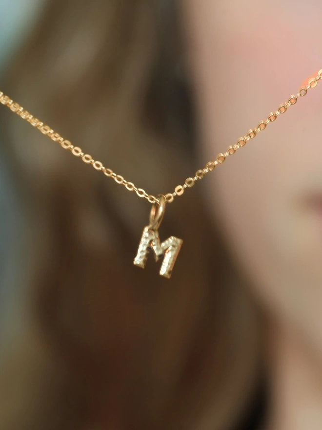 small gold letter pendant 