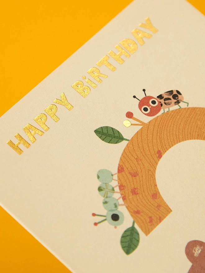 Detail image of the special gold foil details on the Raspberry Blossom children’s birthday card