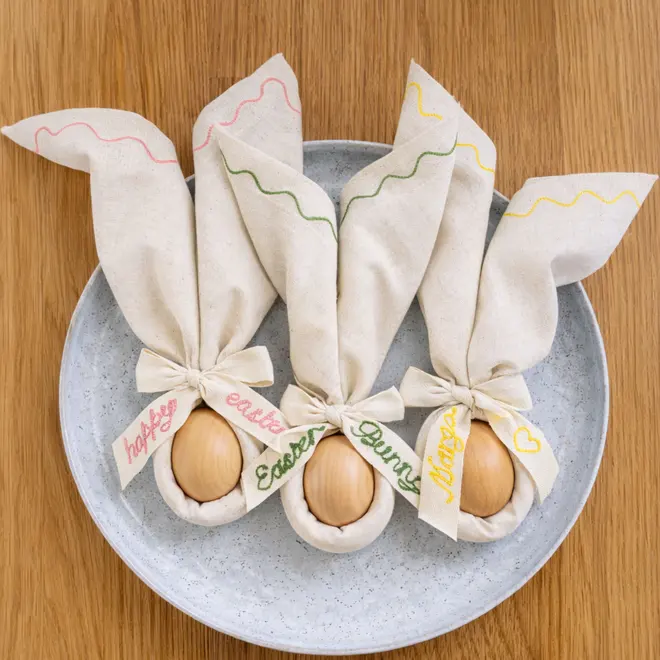 Embroidered Easter napkins with embroidered cotton twill bow with wooden egg