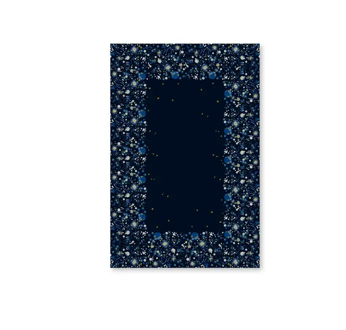 Solaris Tablecloth In White Or Blue. Blue tablecloth with blue and yellow starburst motifs on a white background. 