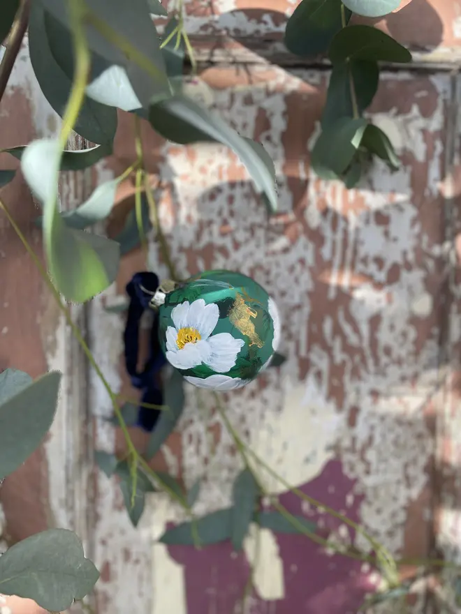 hand painted floral ceramic Christmas bauble ornament rich green painted with white tree poppies 