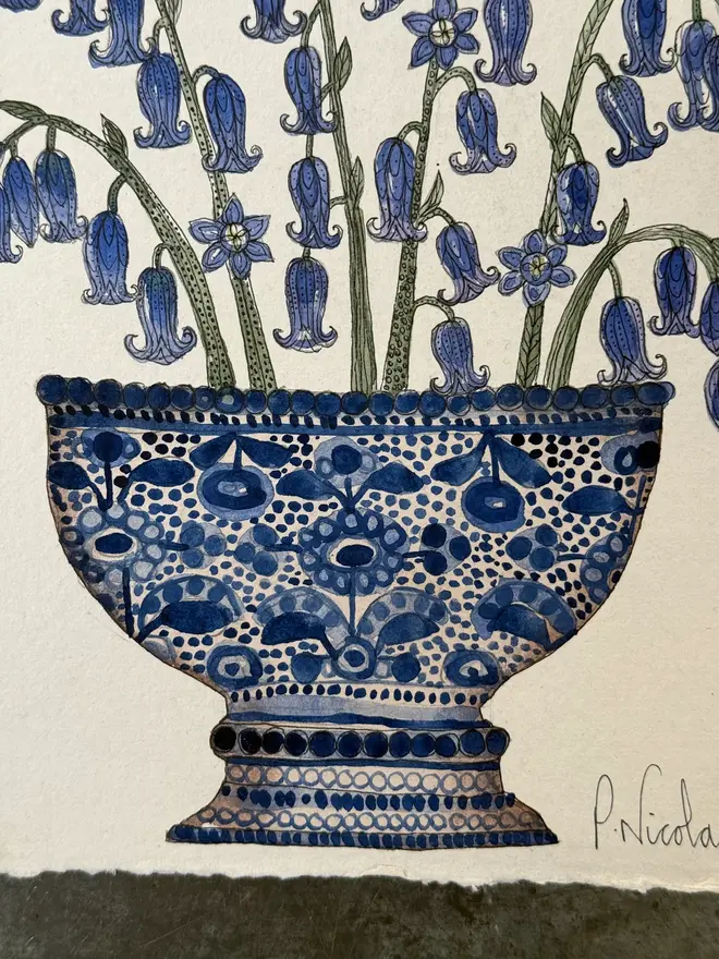 bluebells in a blue & white ceramic vessel