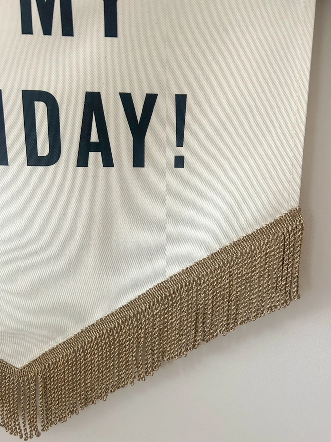 Gold bullion trim on a handmade large fabric birthday banner