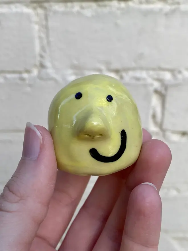 yellow handmade ceramic buddy ornament