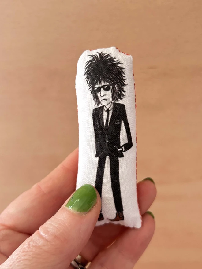 Mini fabric doll featuring an illustration of punk poet John Cooper Clarke.