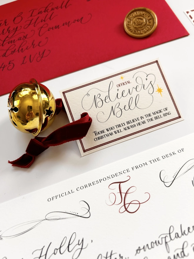 Golden Believer's Bell with calligraphy label and velvet ribbon