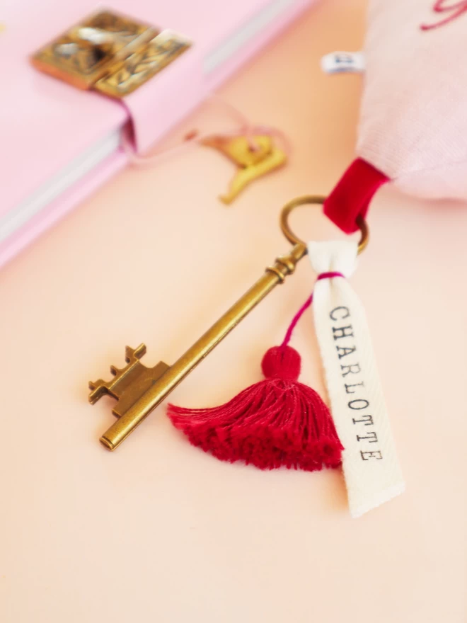 Linen heart shaped ornament with Lucky Girl or Boy embroidery,  velvet ribbon and antique key with a name. 