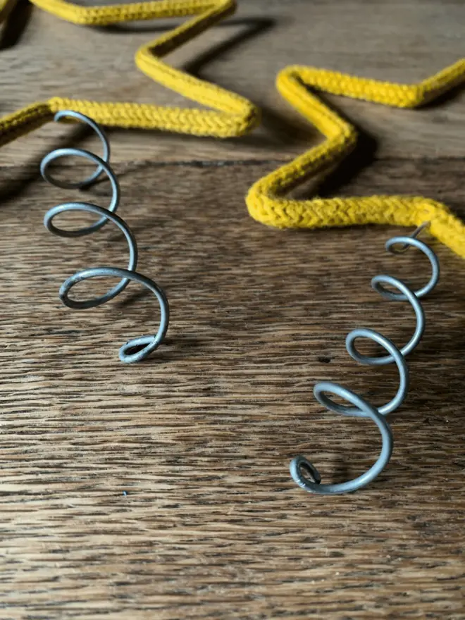 Close up of a large and a standard sized coils of two tree toppers