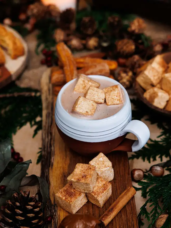 The-Mallow-Makers-mug-of-hot-chocolate-with-churro-marshmallows-coated-in-cinnamon-sugar-on-a-christmas-tablescape