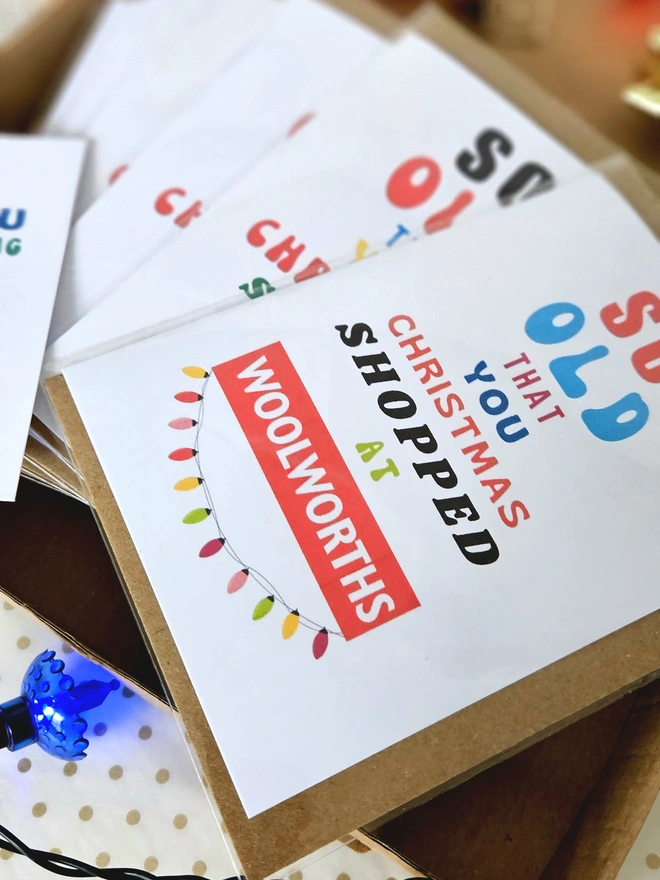 A photograph of a set of nostalgic shop cards in different designs in a box with a thank you card for shopping at Holly and Co