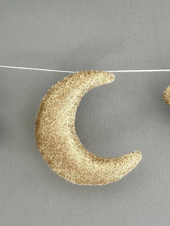Planet And Stars themed garland hanging in a child’s bedroom, nursery decoration, baby gift