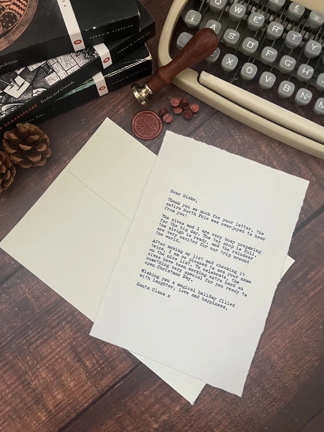 letter to santa, hand typed onto handmade cotton rag paper using an antique typewriter with a merry christmas red wax seal and envelope. 
