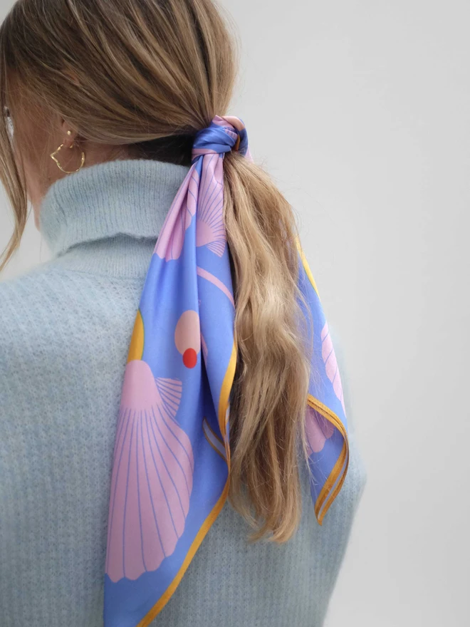 'Sea Shells - Blue and Pink' Silk Scarf tied around a ponytail