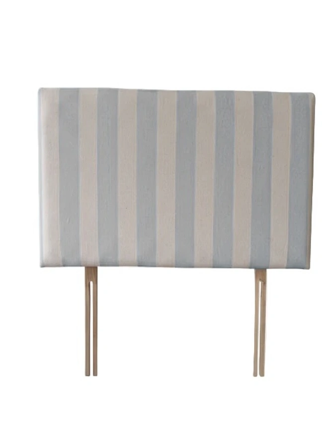 Hand Painted Upholstered Linen Headboard In Stripe Print, a metallic silver striped headboard sitting against a white background. 