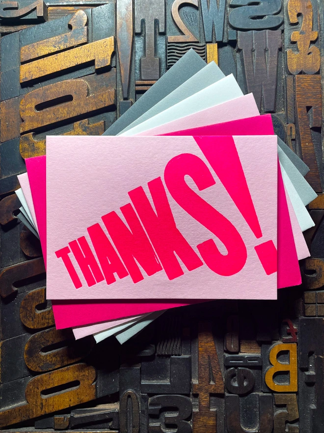 Thanks! A vibrant thank you typographic letterpress candy pink card with deep impression print using fluorescent pink, with a range of colourful envelopes. Slight print variations adding to the style anding to the charm of this handmade greeting card.