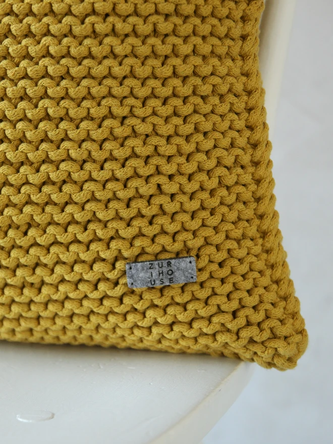 hand kintted golden kiwi square cushion