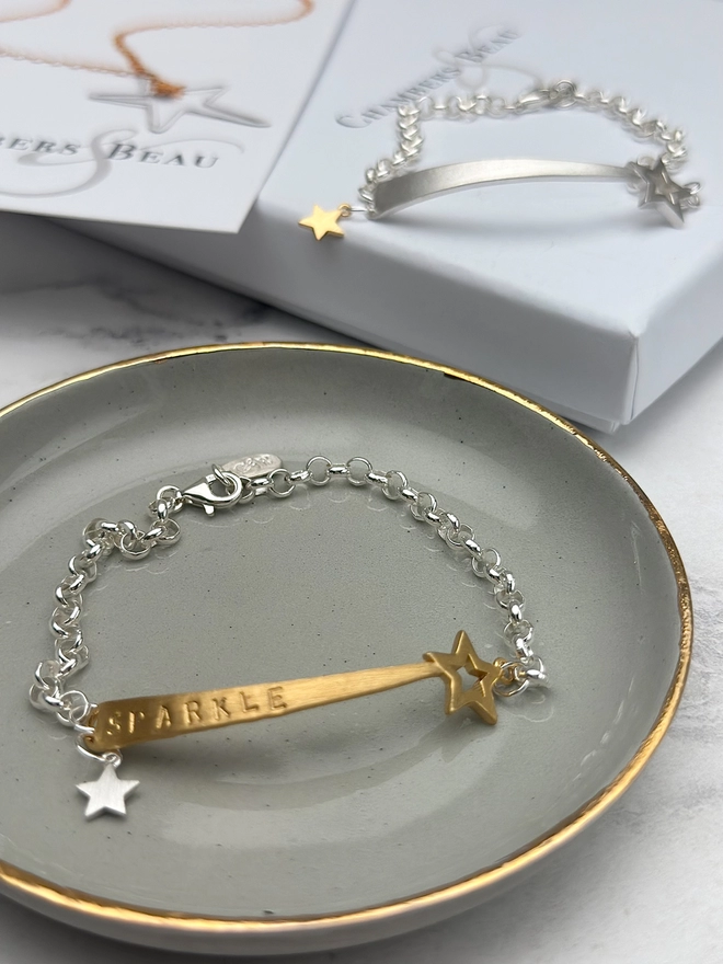 personalised shooting star charm bracelet in gold on silver belcher chain with additional silver star charm
