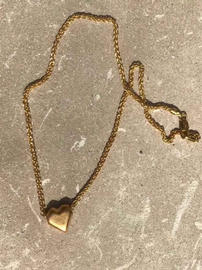 a beautiful contemporary gold heart pendant 