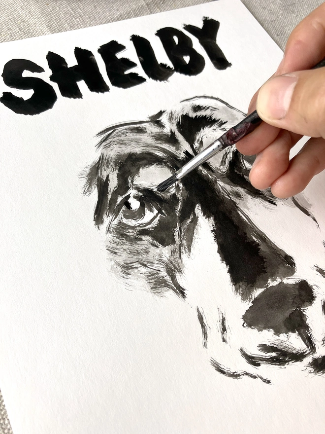 artist 'Dogs by Jeff' painting a personalised dog portrait of a long haired dachshund 