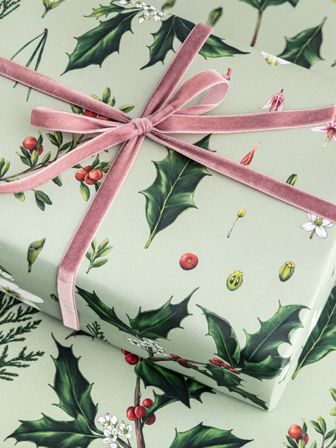 Green based Christmas wrap with festive elements pattern