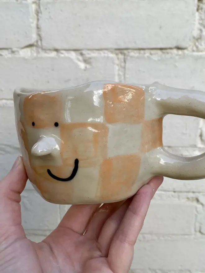 peachy checked handmade ceramic smiley face mug