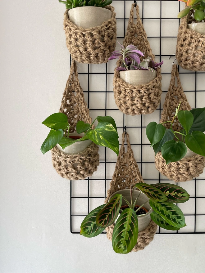 indoor small brown jute hanging wall planter, fabric wall mounted plant holder, handmade crochet plant basket, handmade sustainable crochet decor, rustic natural organic homeware accessories, hanging plant holder