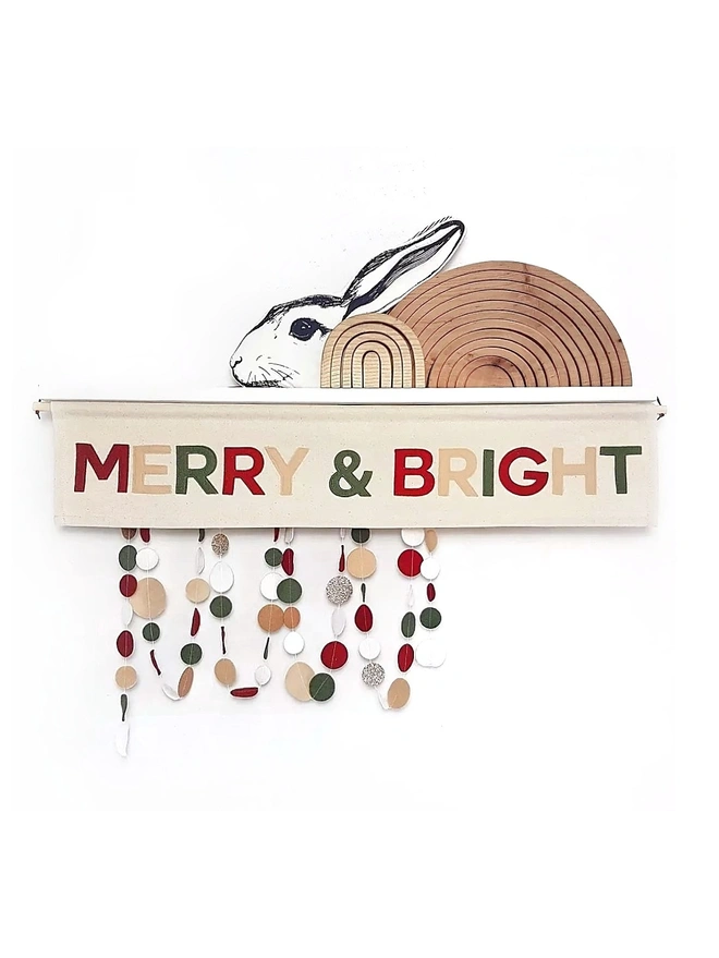 Merry & Bright stitched onto a fabric banner in traditional Christmas colours