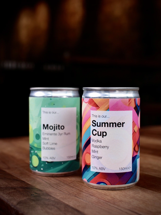 Mojito and Summer Cup cans against a dark background