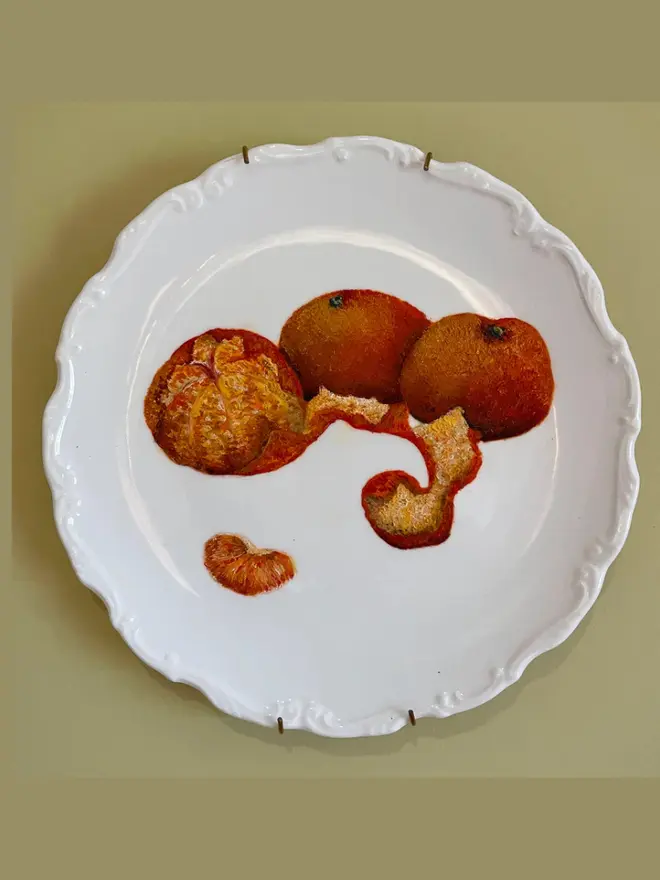 Fine Art Oil Painted Three Mandarins.On Ornate Antique Plate, hanging on a yellow background. 