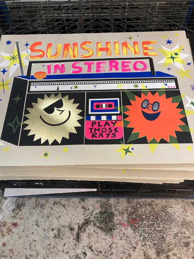 'Sunshine In Stereo' Screenprint, a group of colourful stereo screenprints on a studio rack. They read 'Sunshine in stereo. 
