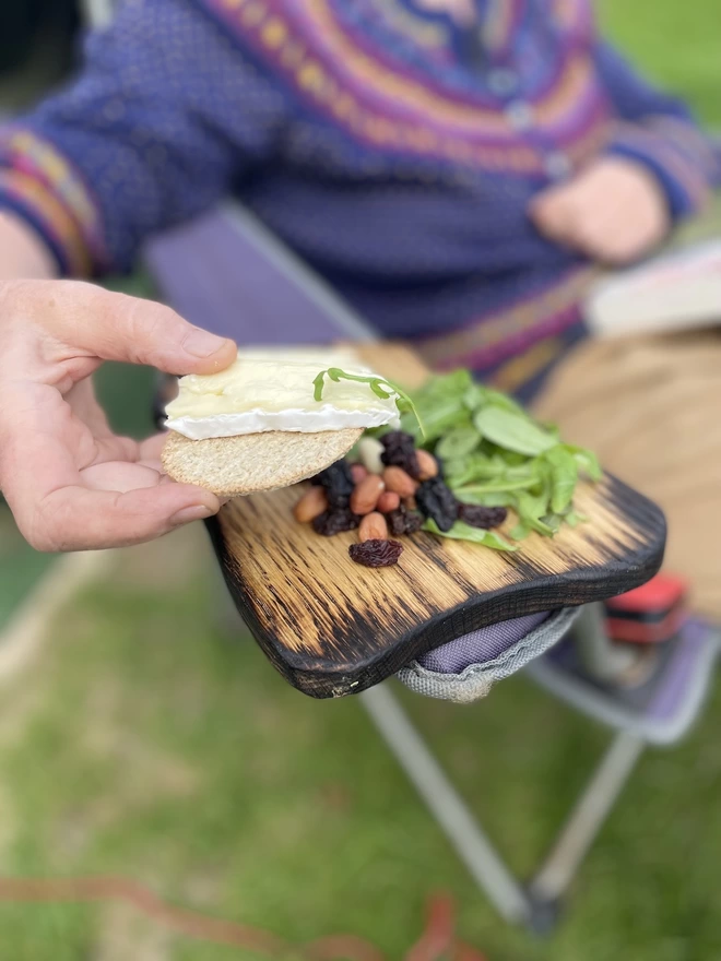 Toast Shaped Oak Serving Board with Food outside 