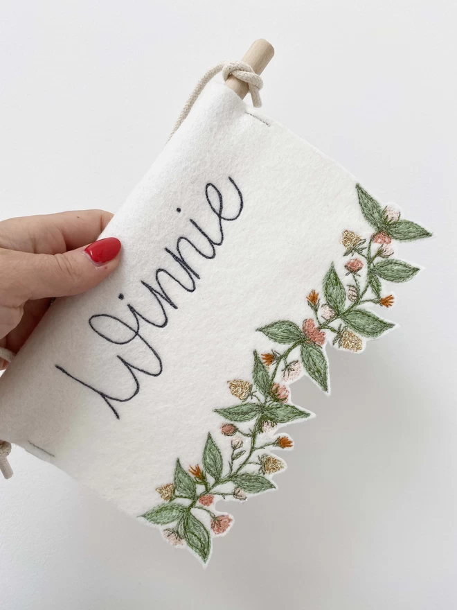 Flower Trim Personalised  Felt Banner being held