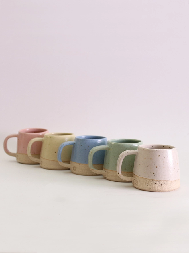 row of 5 pastel mini mugs
