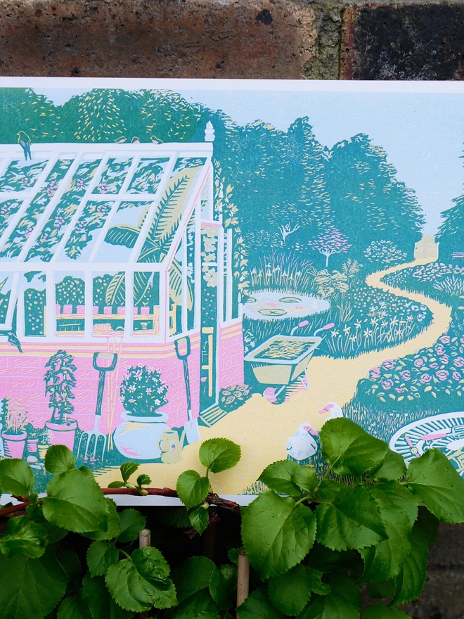 A vibrant print of a garden and greenhouse 