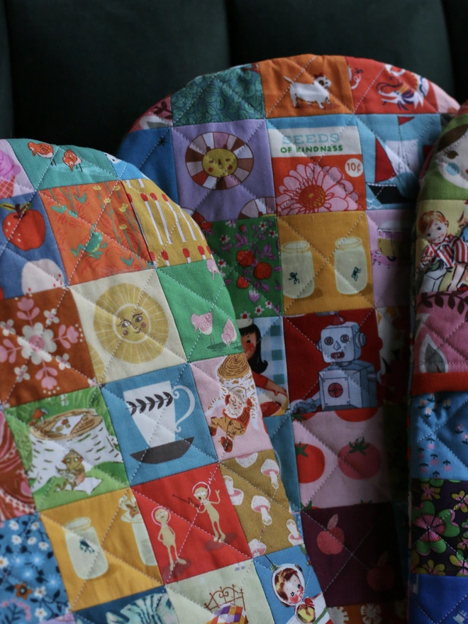 pretty patchwork hot water bottle covers in rainbow colours