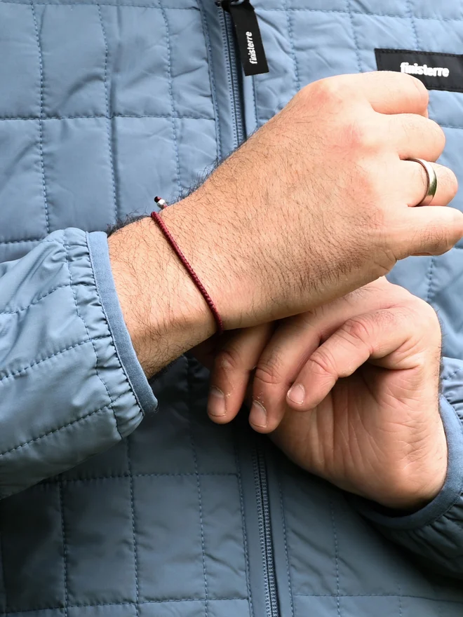 red cord bracelet