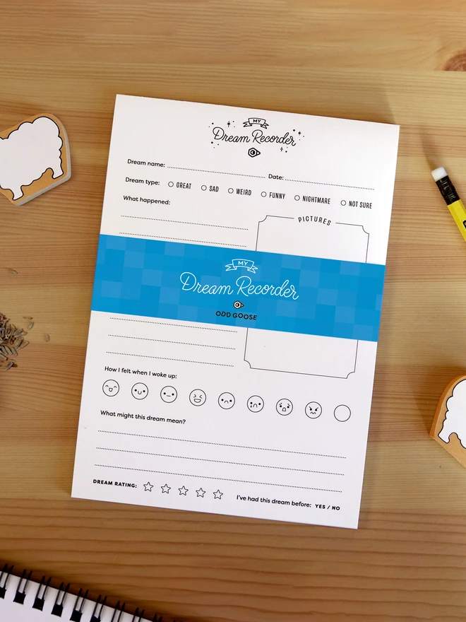 Odd Goose Dream Recorder Journal Notepad seen top down on desk with stationery items