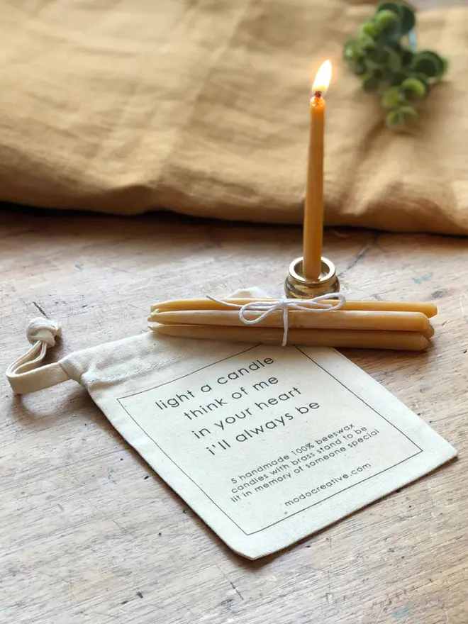 made from: 100% beeswax, brass stand and cotton carry pouch  dimensions: each candle approx 12cm long candle set 