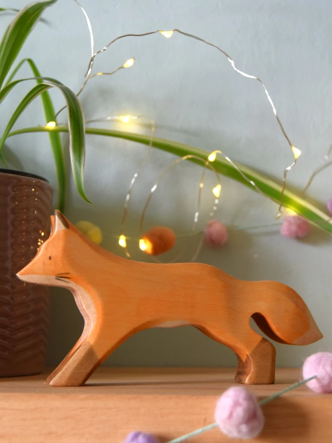 running adult fox toy on shelf