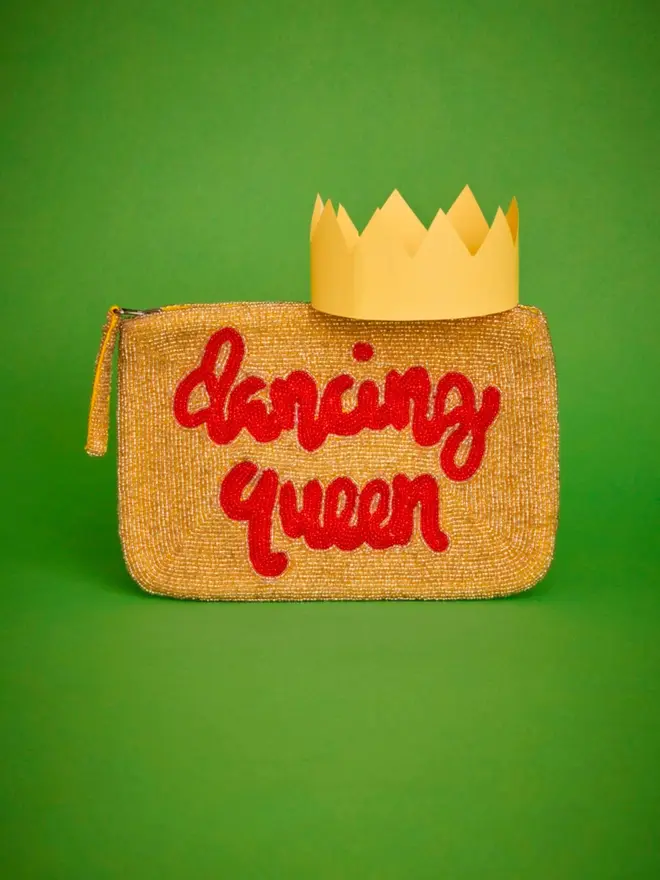 dancing queen beaded clutch, gold with scarlet writing