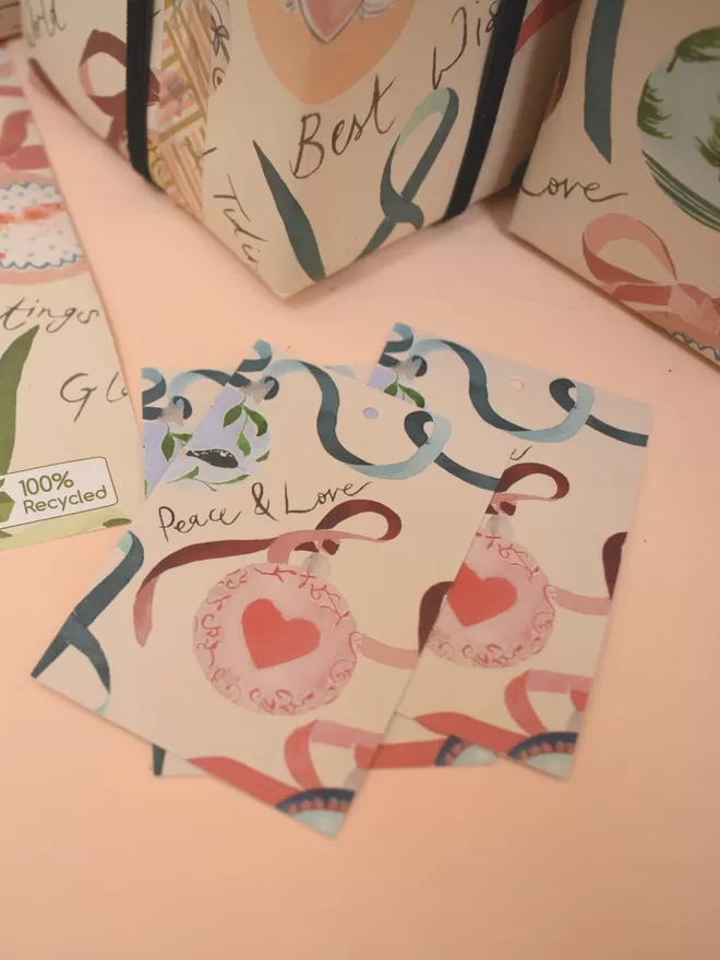 Liz Temperley's Christmas Baubles Gift Cards which match the wrapping paper seen behind.